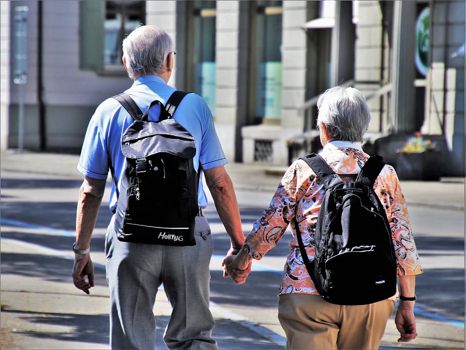 man, woman, holding, hands, walking, street, senior, older person, para, total