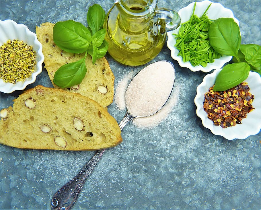 bread, olive, oil, green, leafy, veggies, olive oil, salt, herbs, spoon
