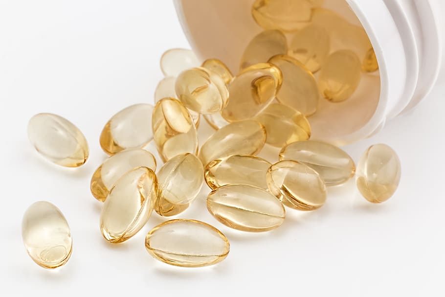 gold gel capsules, pill, gel capsule, medicine, health, cure, drug, vitamin supplements, medication, pharmacy