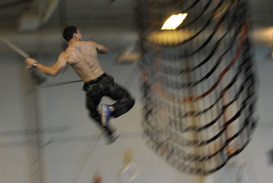 man doing stunt, training, military, navy, seal, usa, man, rope, swing, net