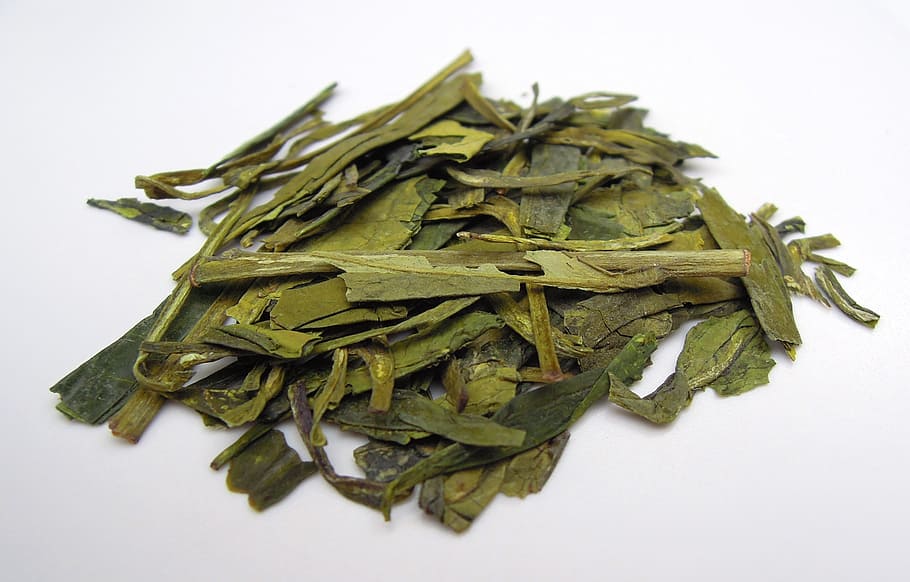 tea leaves, green tea, tea, teacup, dried leaves, food, white background, studio shot, food and drink, indoors