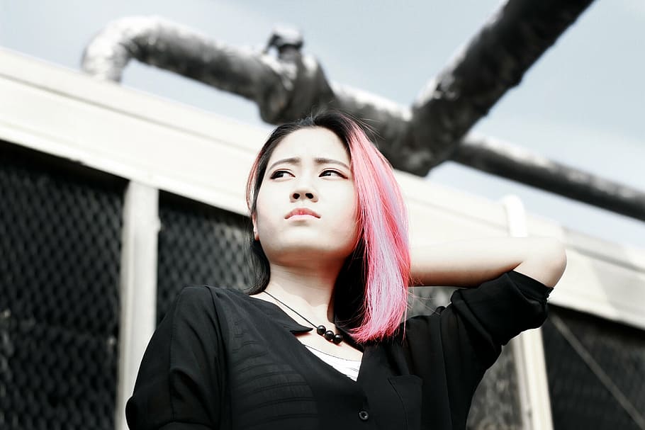 pink-haired woman, wearing, black, shirt, standing, white, building, beautiful, campus, figure