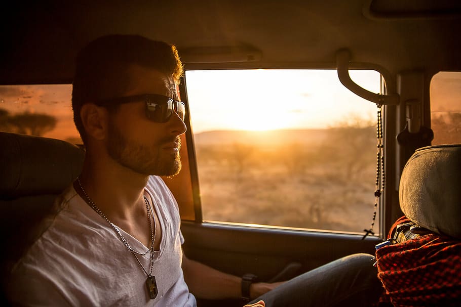 man, sitting, vehicle, golden, hour, wearing, sunglasses, behind, driver, set
