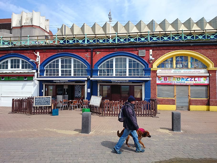 ferry terminal, brighton, pedestrians, walking the dog, architecture, built structure, building exterior, full length, real people, day