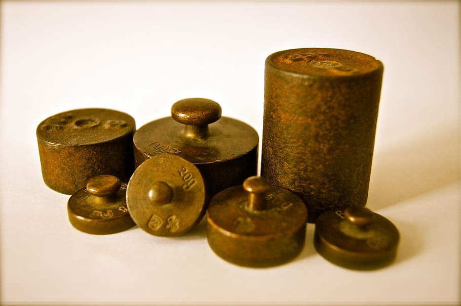 close-up photo, several, copper ornaments, weights, iron, kilo, grams, copper, metal, stainless