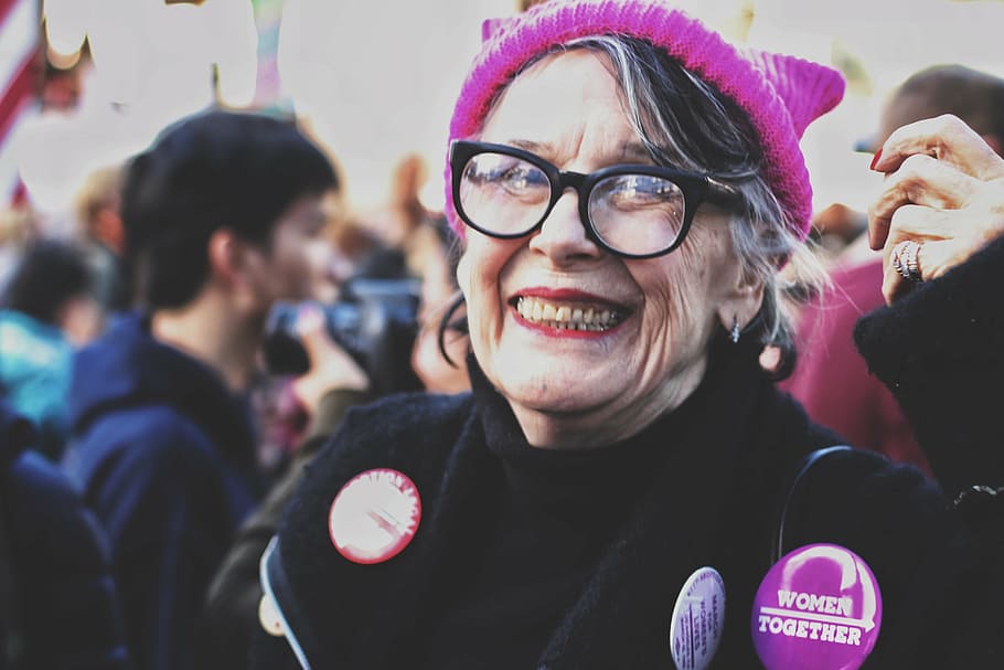 woman, smiling, standing, people, daytime, beanie, girl, grandmother, badges, smile