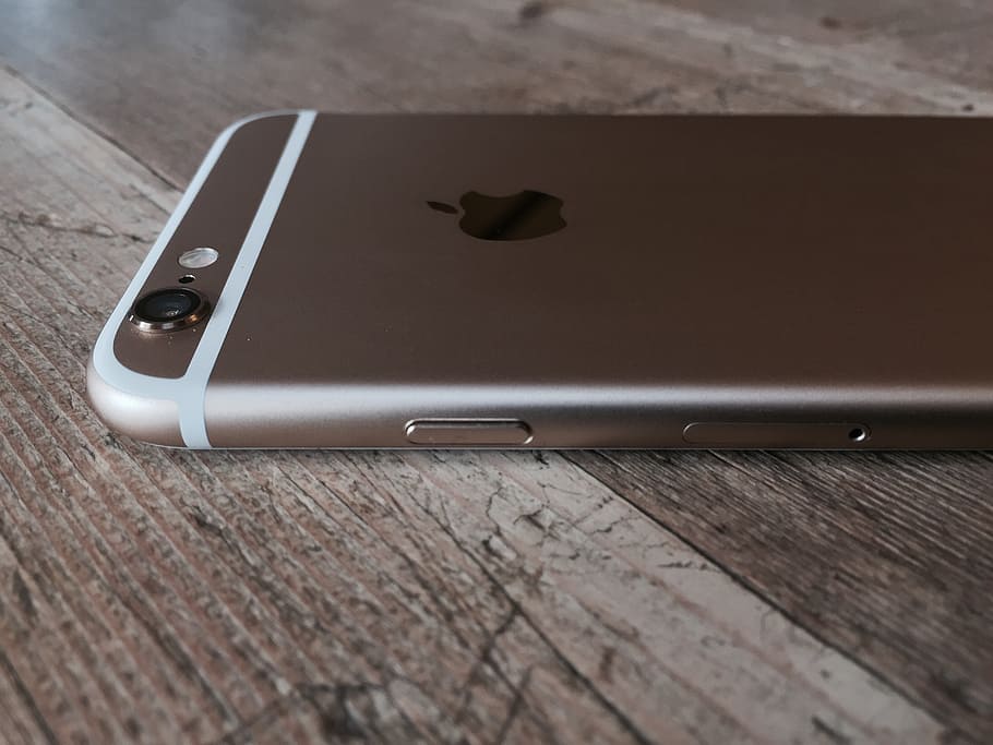 gold iphone 6, iphone, ajfoun, mobile phone, wood - material, table, wireless technology, still life, technology, close-up