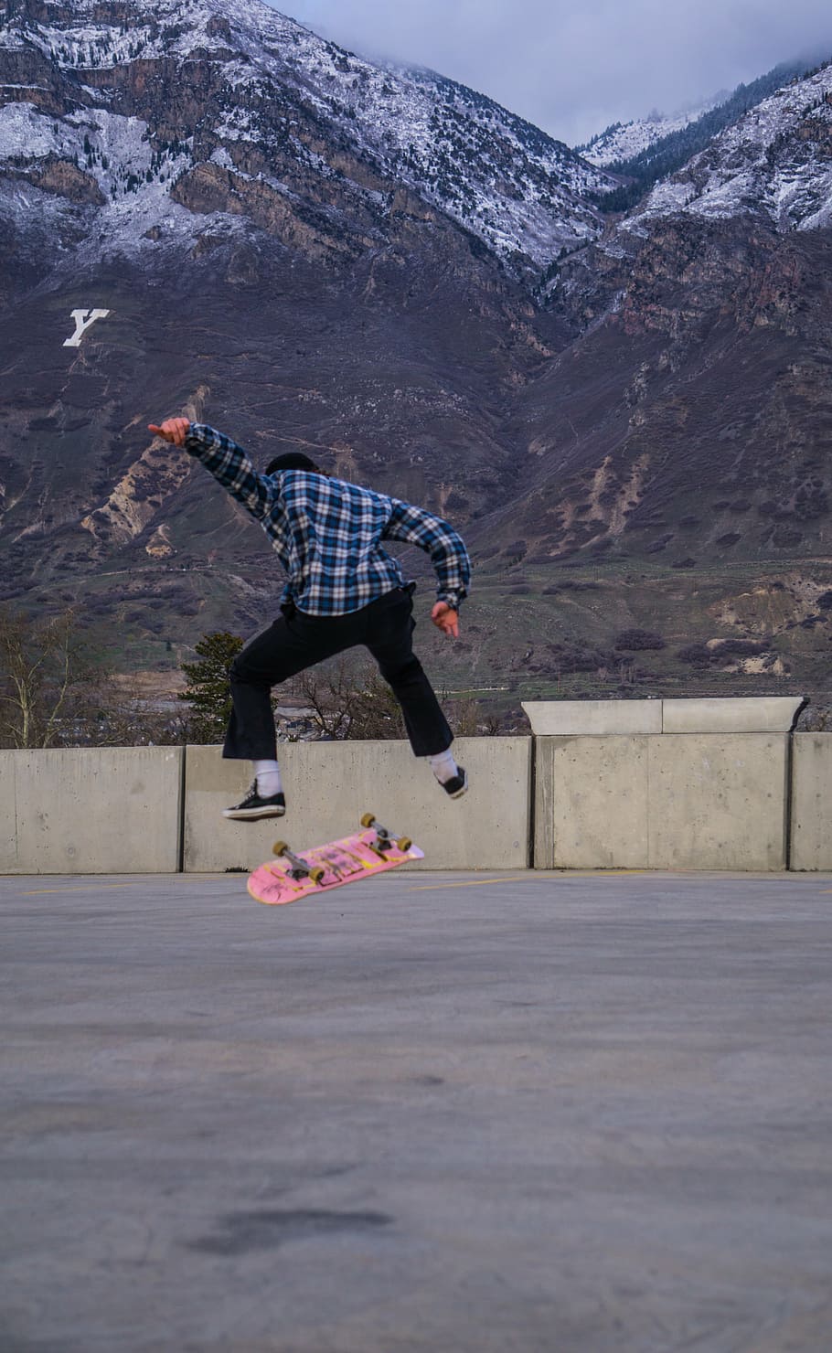 person kick, flip, skateboard, mountain background, man, playing, skate, board, people, skateboarding
