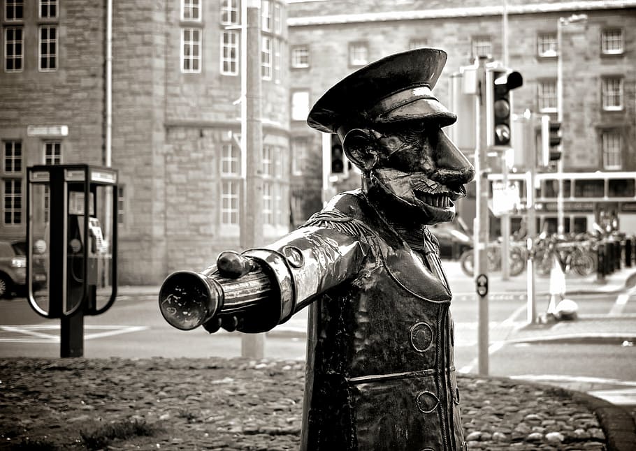 soldier statue, sidewalk, greyscale, statue, near, road, payphone, booth, usher, city