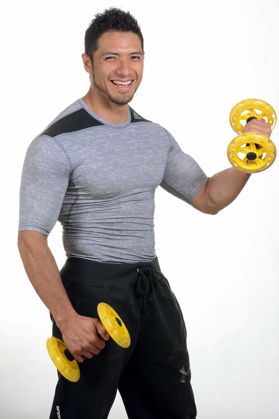 man, wearing, grey, crew-neck shirt, holding, yellow, black, dumbbells, sport, fitness