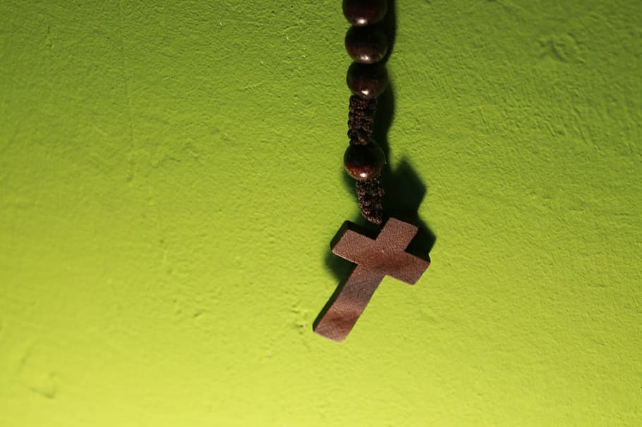 cross, wooden cross, prayer chain, rosary, christianity, faith, green color, close-up, human hand, human body part