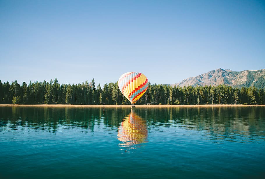 hot air balloon, blue, sky, lake, water, reflection, trees, plant, horizon, mountain