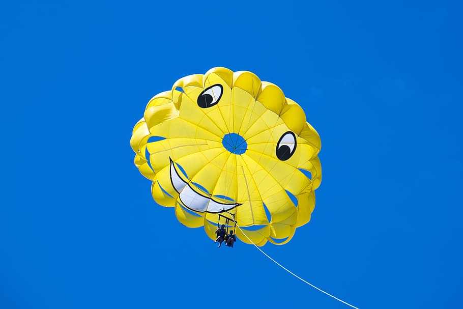 man, riding, yellow, happy, face parachute, blue, sky, happy face, parachute, blue sky