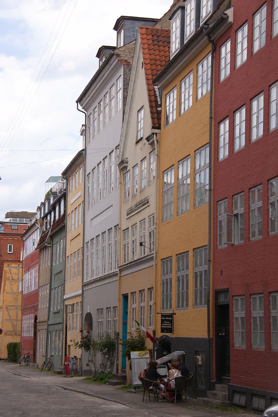 street, copenhagen, christianshavn, denmark, houses, colourful, appartments, pavement, cafe, people