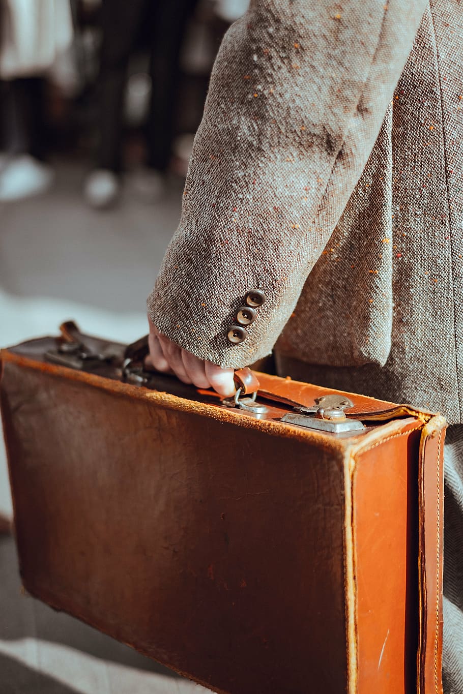person, holding, brown, leather briefcase, taken, daytime, leather, case, bag, people