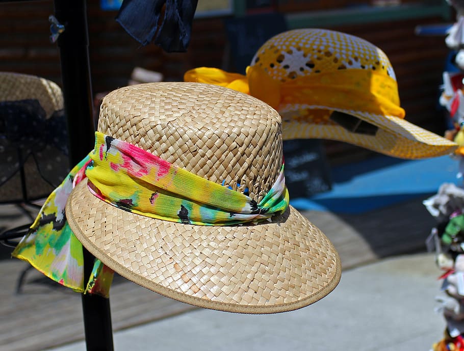 sun protection, hat, straw hat, headwear, sun hat, clothing, focus on foreground, close-up, day, incidental people