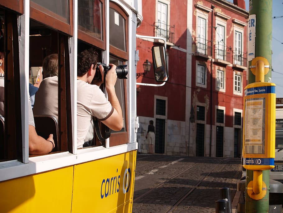 streetcar, photograph, tourist, lisbon, electrico 28, mode of transportation, transportation, real people, public transportation, land vehicle