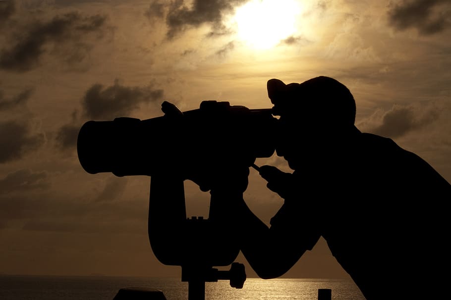 silhouette, man, uses, telescope, daytime, navy binoculars, big eyes, bridge, passing ships, sunset