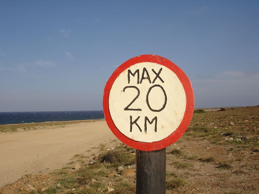 speed limit, board, road sign, sky, sea, communication, water, horizon over water, beach, land