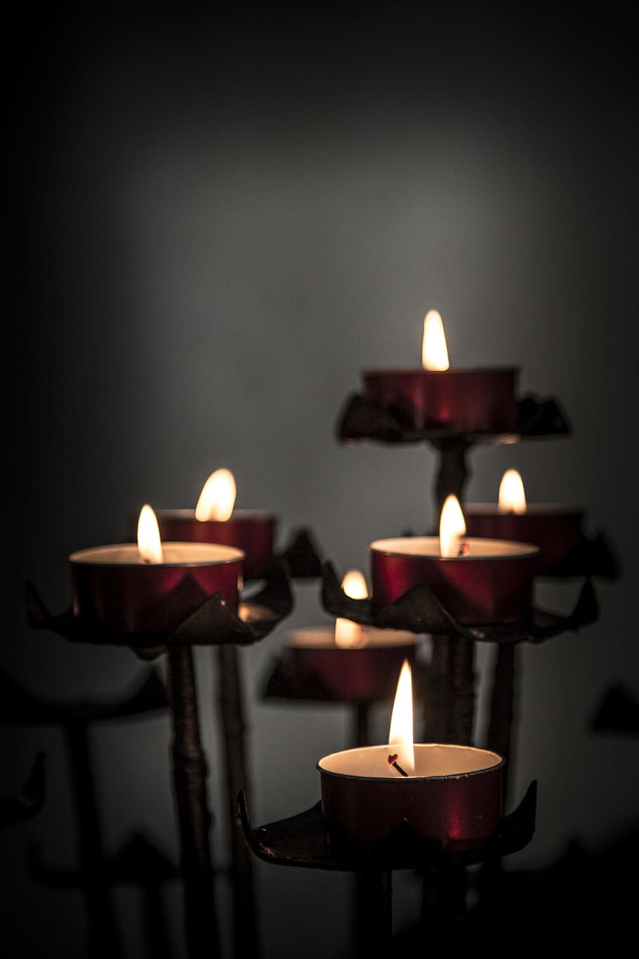lit tealights, church, candles, votive, religion, religious, light, symbol, flame, candlelight