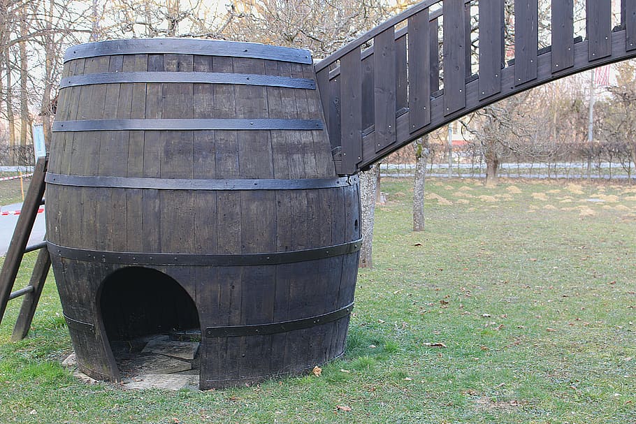 wine barrel, barrel, wooden barrels, day, plant, grass, nature, architecture, built structure, field