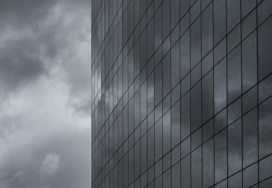 high-angle greyscale photo, building, grayscale, photography, windows, architecture, city, sky, dark, storm