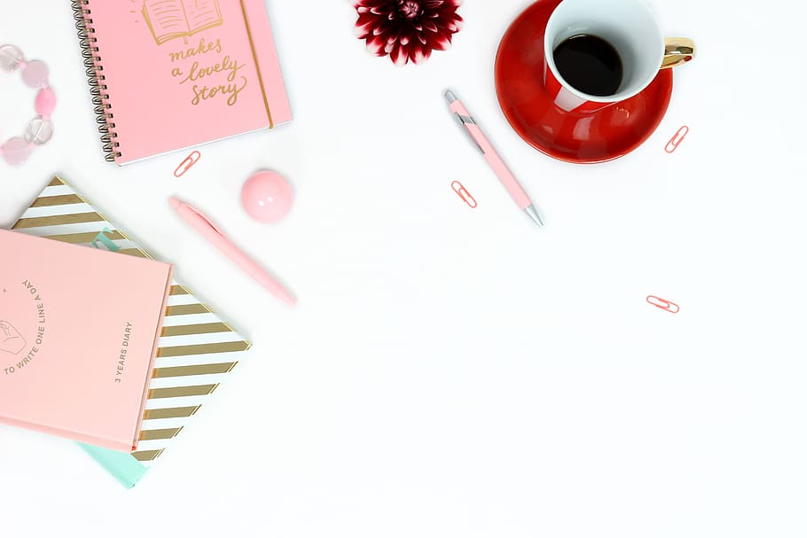 workplace, desk, feminine, pink, notebooks, pens, gold, golden, red, red cup