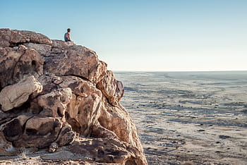 person, sitting, cliff, mountain, man, edge, nature, landscape, rocks, ground