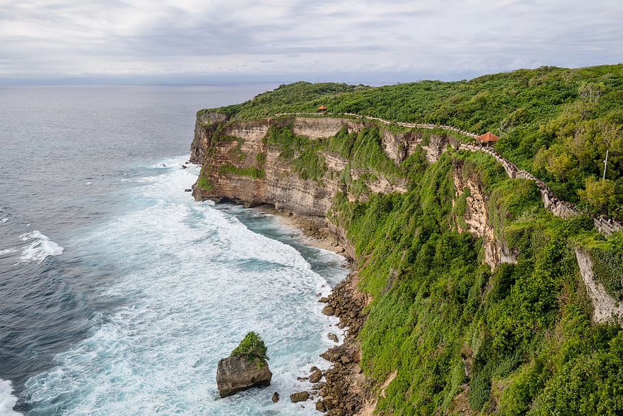 gray, rock formation, covered, greenery, next, ocean, bali, indonesia, temple, travel