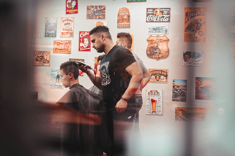 man, wearing, black, crew-neck t-shirt, holding, hair, trimmer, barbershop, haircut, hairstyles