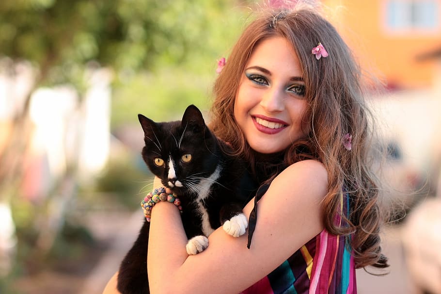 focus photography, woman, carrying, tuxedo cat, daytime, focus, photography, girl, cat, love