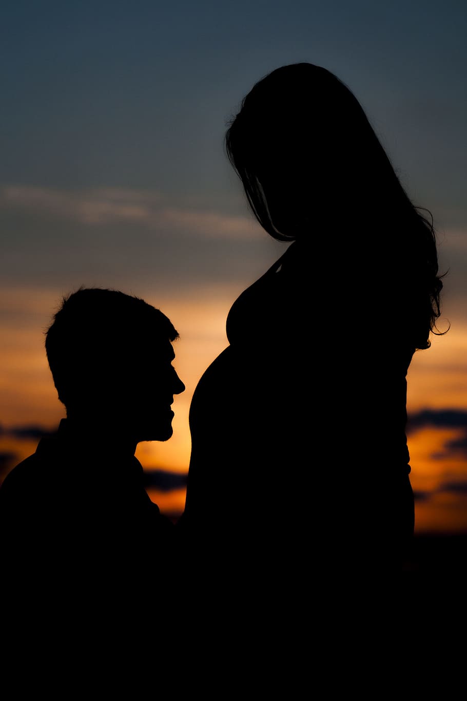 silhouette, man, facing, pregnant, woman, stomach, couple, sunset, joy, child