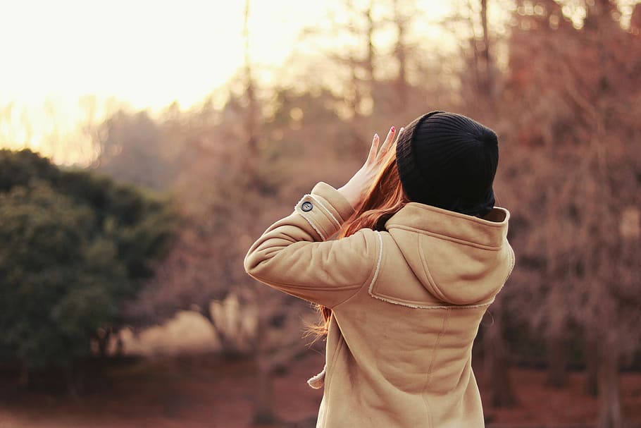 woman, wearing, brown, jacket, black, knit, cap, shouting, trees ...