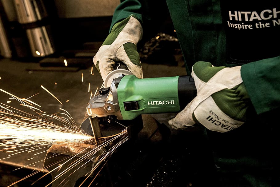 person, using, green, hitachi angle grinder, grinder, hitachi, power tool, flexible, grind, building