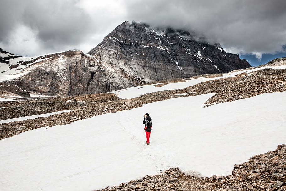 person, walking, snow, mountain, highland, cloud, sky, summit, ridge, landscape