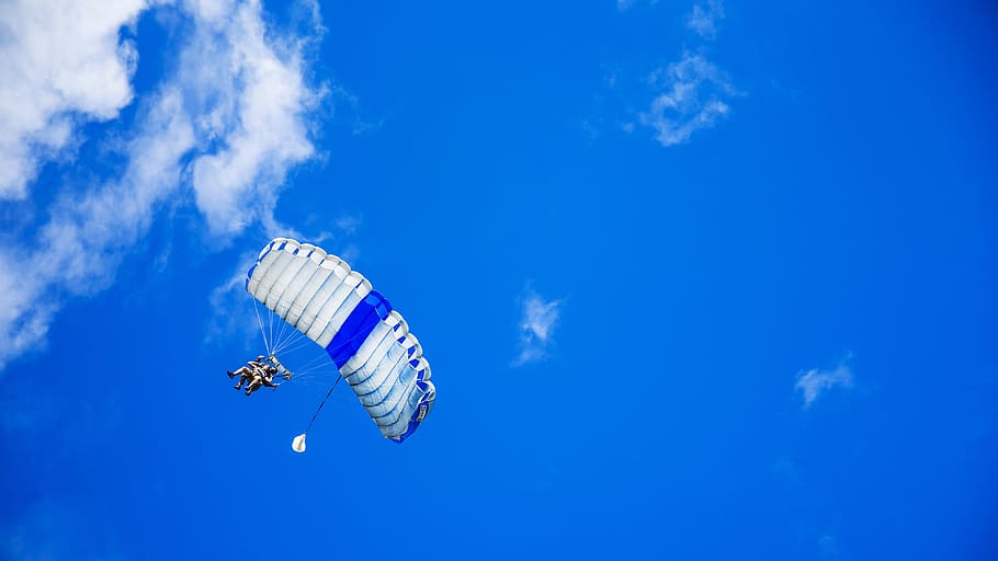 person doing paragliding, parachute, parachuting, parachutist, skydiving, sky, skydive, jump, risk, hobby
