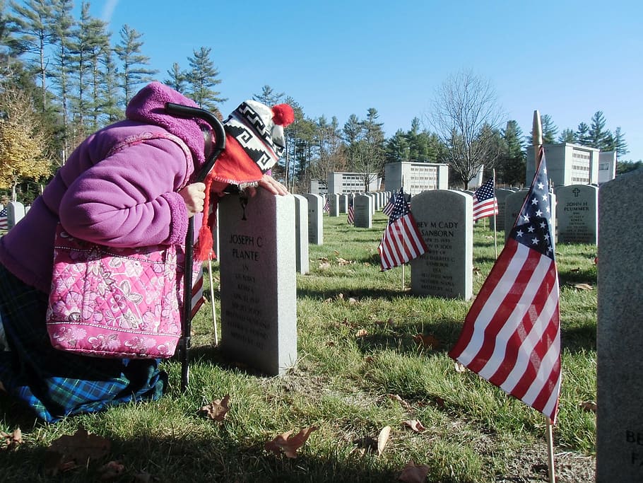 person, leading, head, tombstone, cemetery, veteran, widow, sadness, memorial, honor