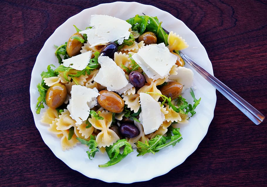 round, ceramic, plate, food, ceramic plate, pasta salad, olives, feta cheese, arugula, mediterranean