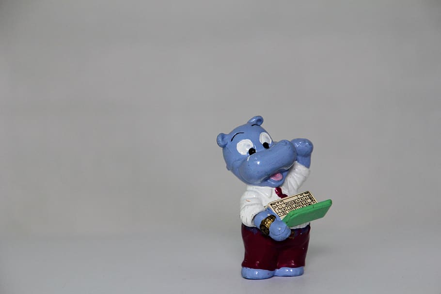 blue, ceramic, hippo figurine, computer nerd, laptop, happy hippo, überraschungseifiguren, chef, gray background, studio shot