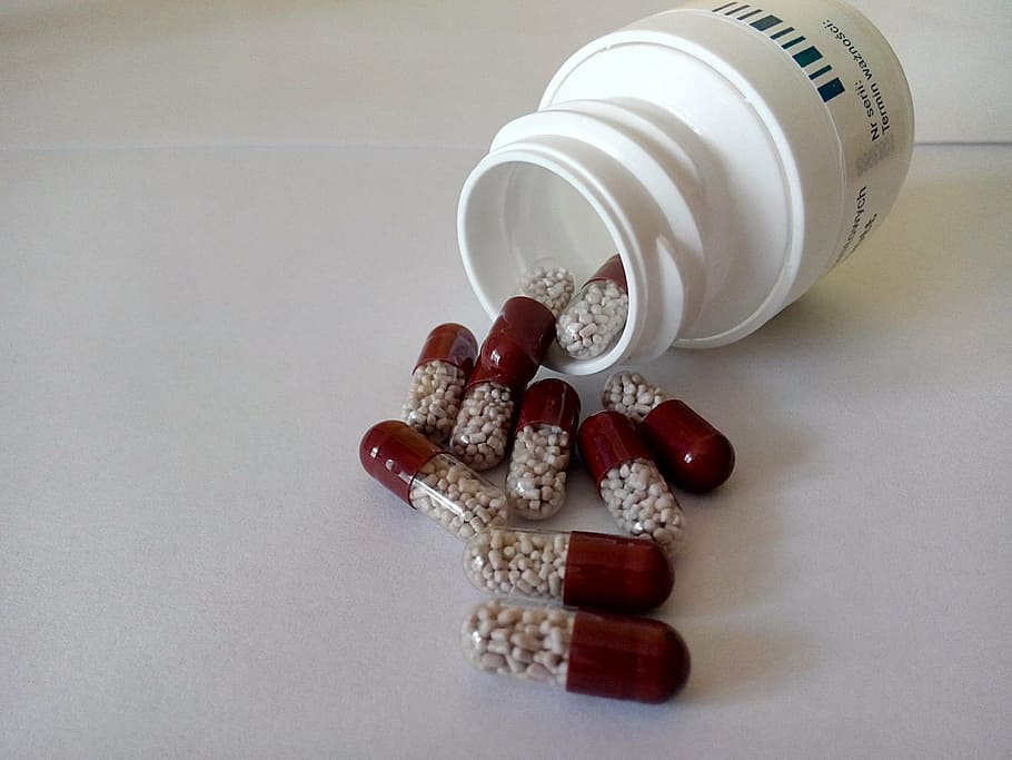 red-and-clear medicine capsules, white, surface, drugs, pill, medication, medicine, health, pain, tablet
