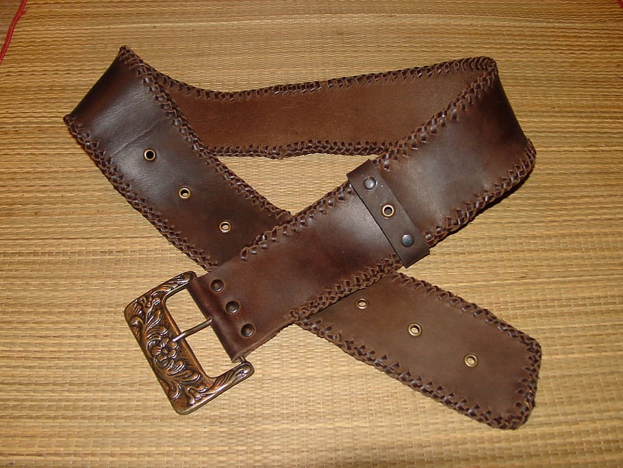 belt, skin, leather goods, buckle, indoors, brown, leather, close-up, wood - material, still life