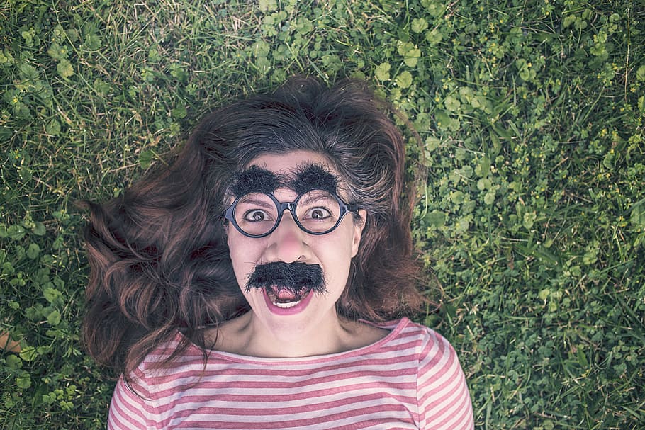 woman, fake, mustache, eyebrow, lying, green, grass, grimace, funny, expression