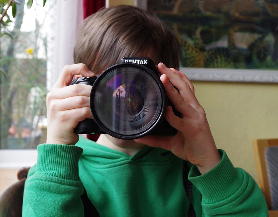 person, using, black, pentax slr camera, inside, room, photography, boy, camera, portrait