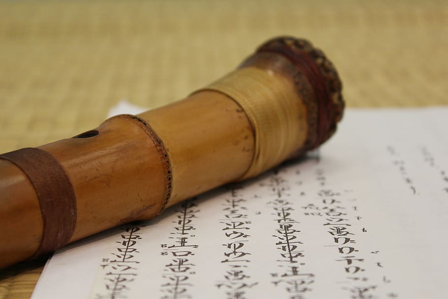 brown, wooden, wind instrument, paper, japanese flute, character, bamboo, mat, music, tool
