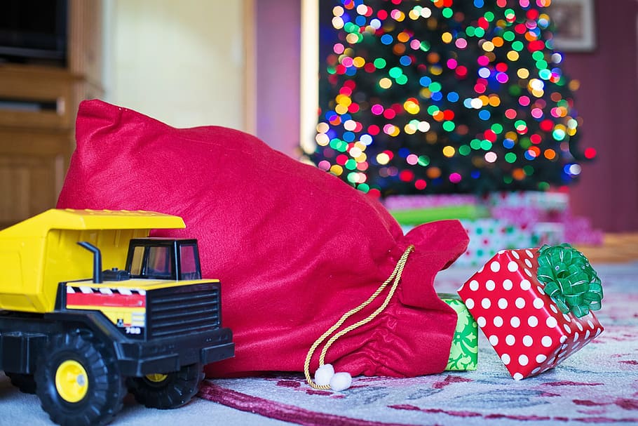 selective, focus photography, yellow, haul truck toy, red, drawstring bag, gifts, christmas, xmas, santa's sack