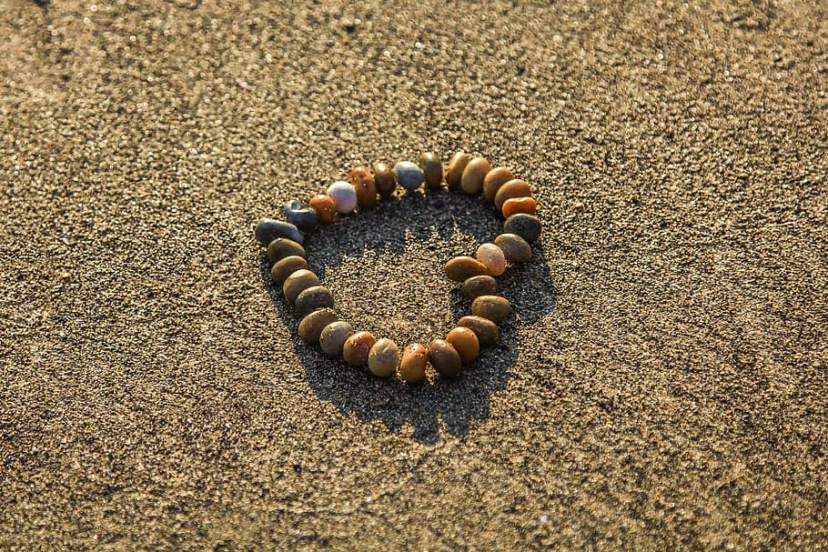 assorted stone fragments, heart, rhinestones, sand, beach, ocean, heart shape, love, communication, anthropomorphic smiley face