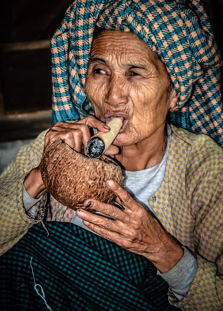 woman, holding, brown, tobacco, coconut, face, portrait, myanmar, burma, old