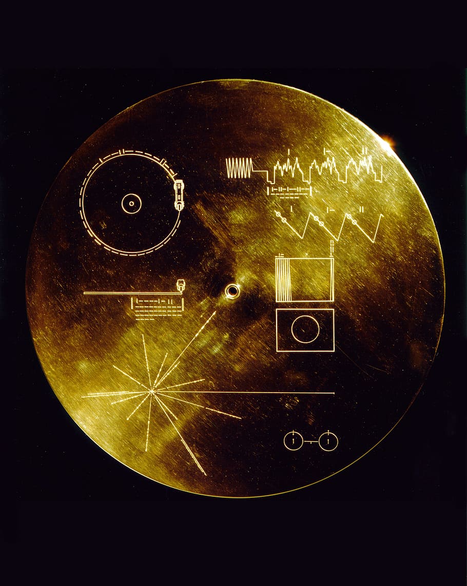 round gold-colored decor, space travel, voyager golden record, data sheets, voyager 1, voyager 2, humanity, universe, gold, precious metal