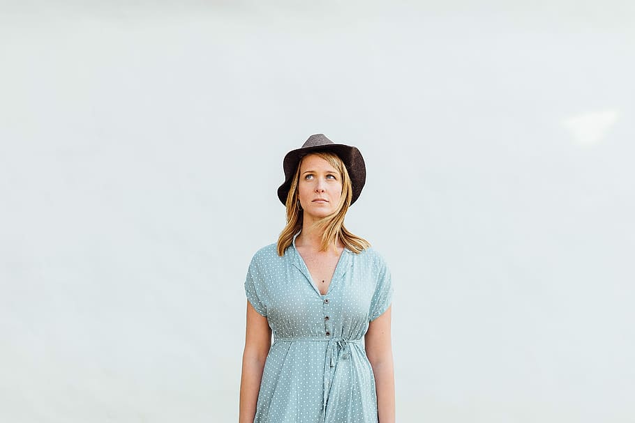 woman, wearing, teal, half-button, cap, sleeve, dress, black, hat, black hat