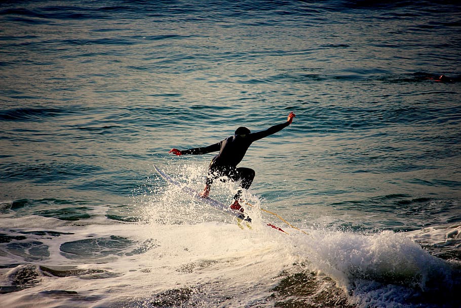 person, wearing, black, wet, suit, performing, surfboarding, blue, body, water